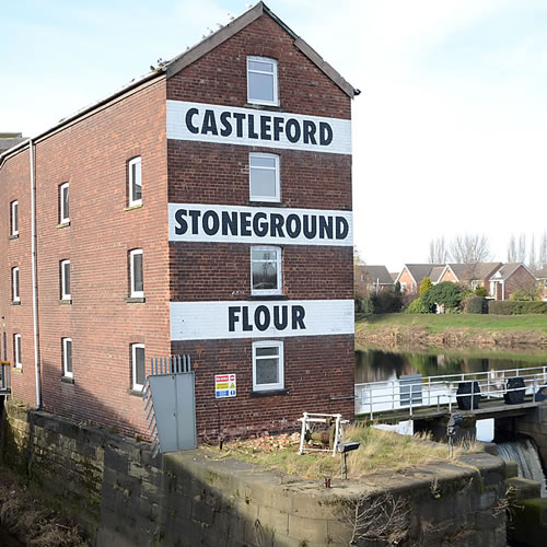 Image of the Queens Mill on the banks of the river Aire in Castleford
